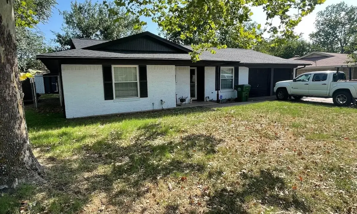 Professional roofing crew working on a residential roof in Inverness